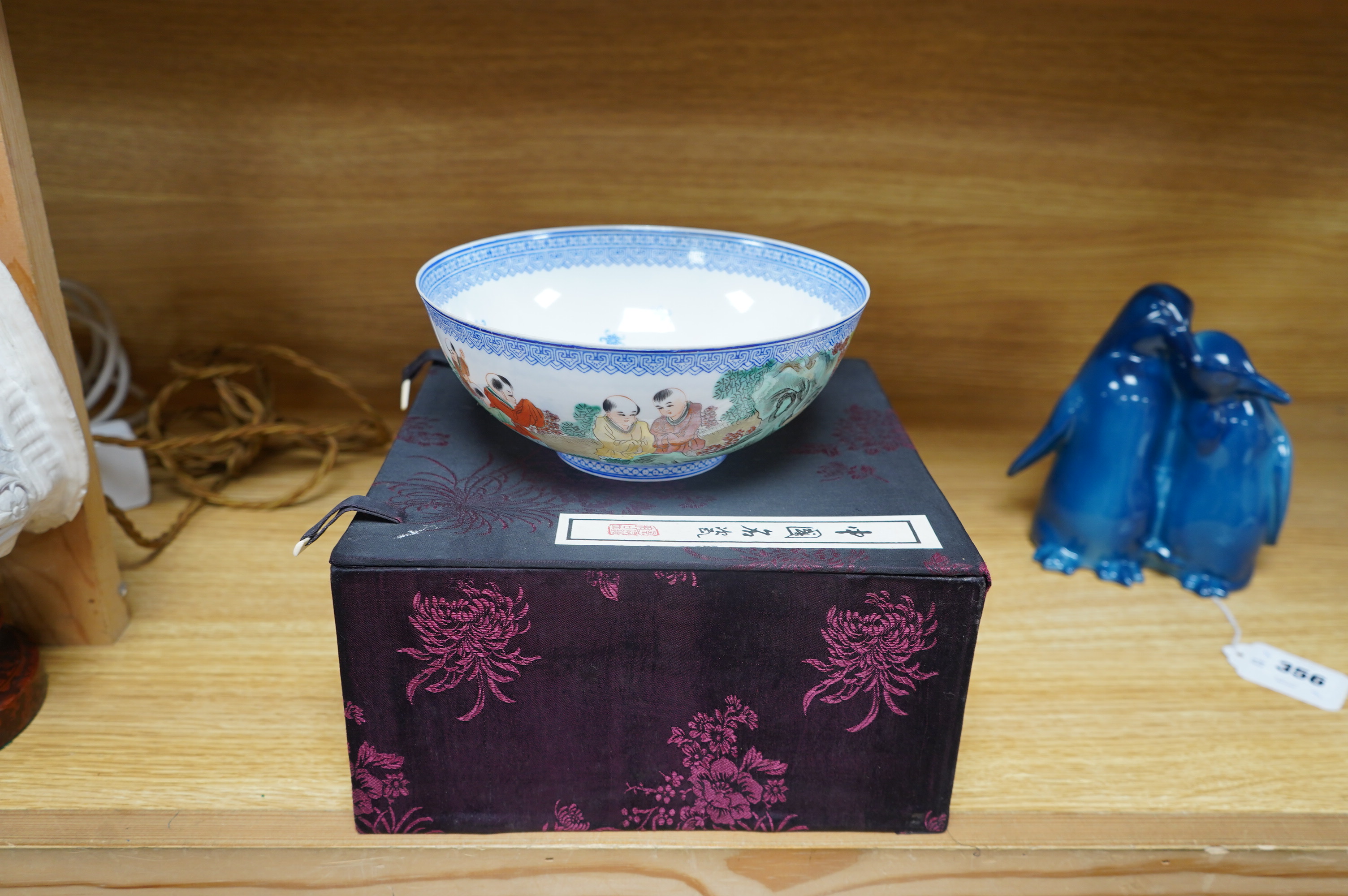 A Chinese eggshell porcelain bowl, 18cm diameter, boxed. Condition - poor, broken and partially repaired